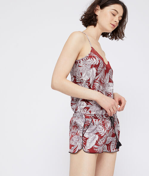 Leaves print shorts brick red.