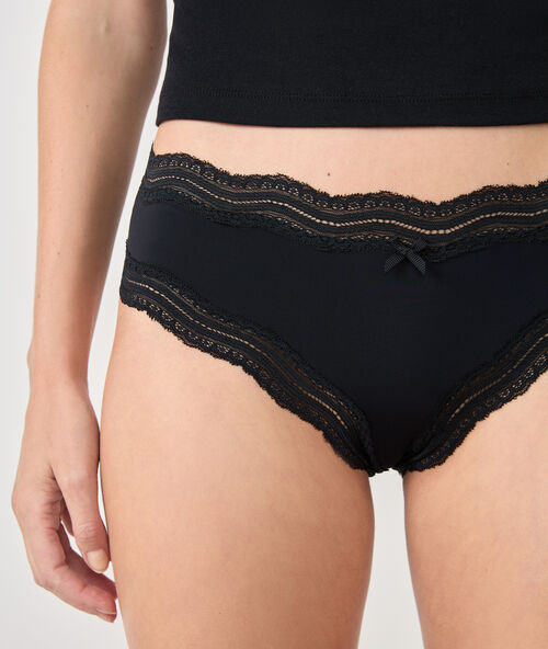 Ornate lace-edged shorts black.