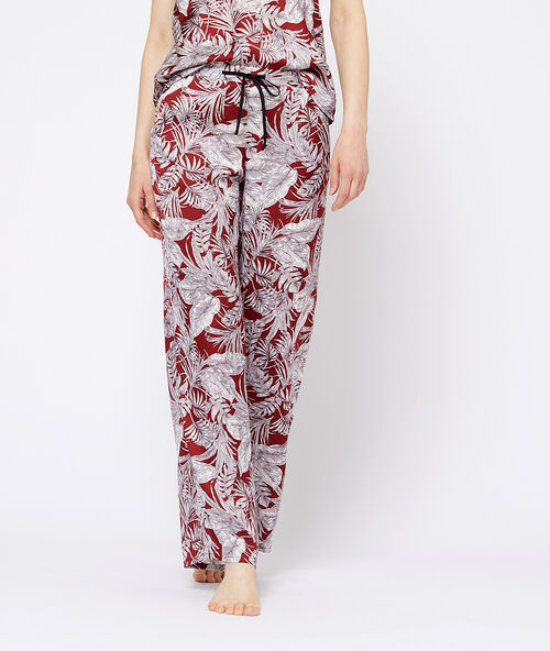 Leaves print trousers red brick.