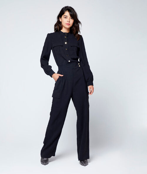 Adjusted jumsuit in modal black.