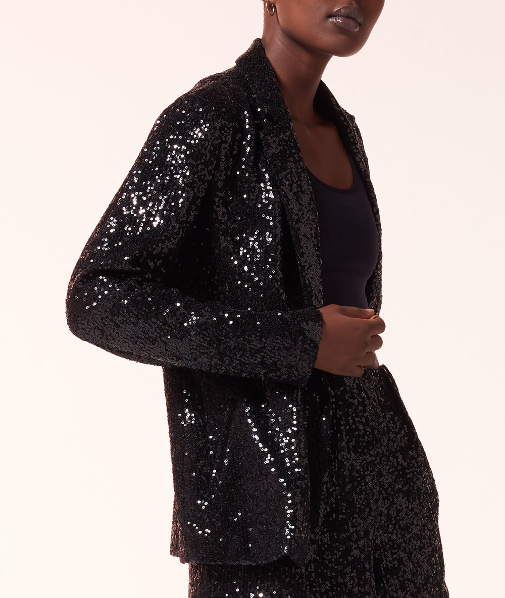 Veste de tailleur en sequins noir.