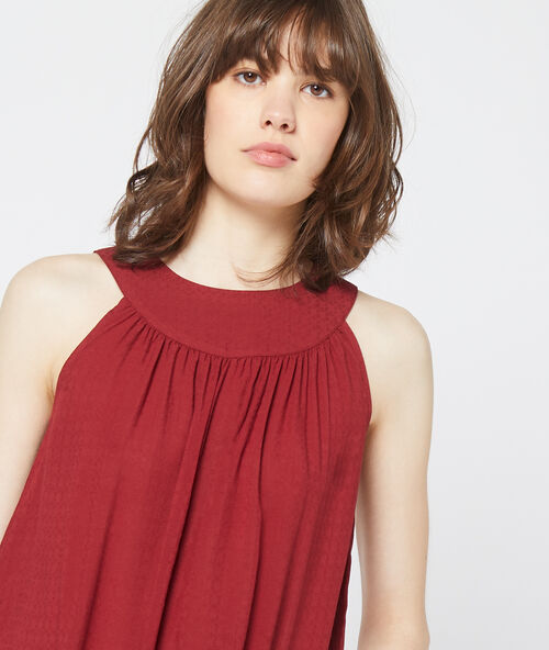 Vest top with button back  garnet-coloured.