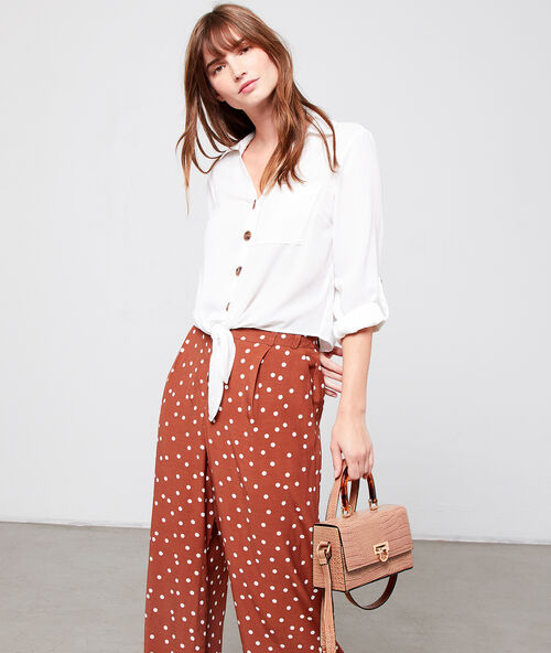 Shirt with amber coloured buttons white.