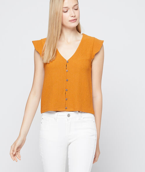 Top with button detail spice.